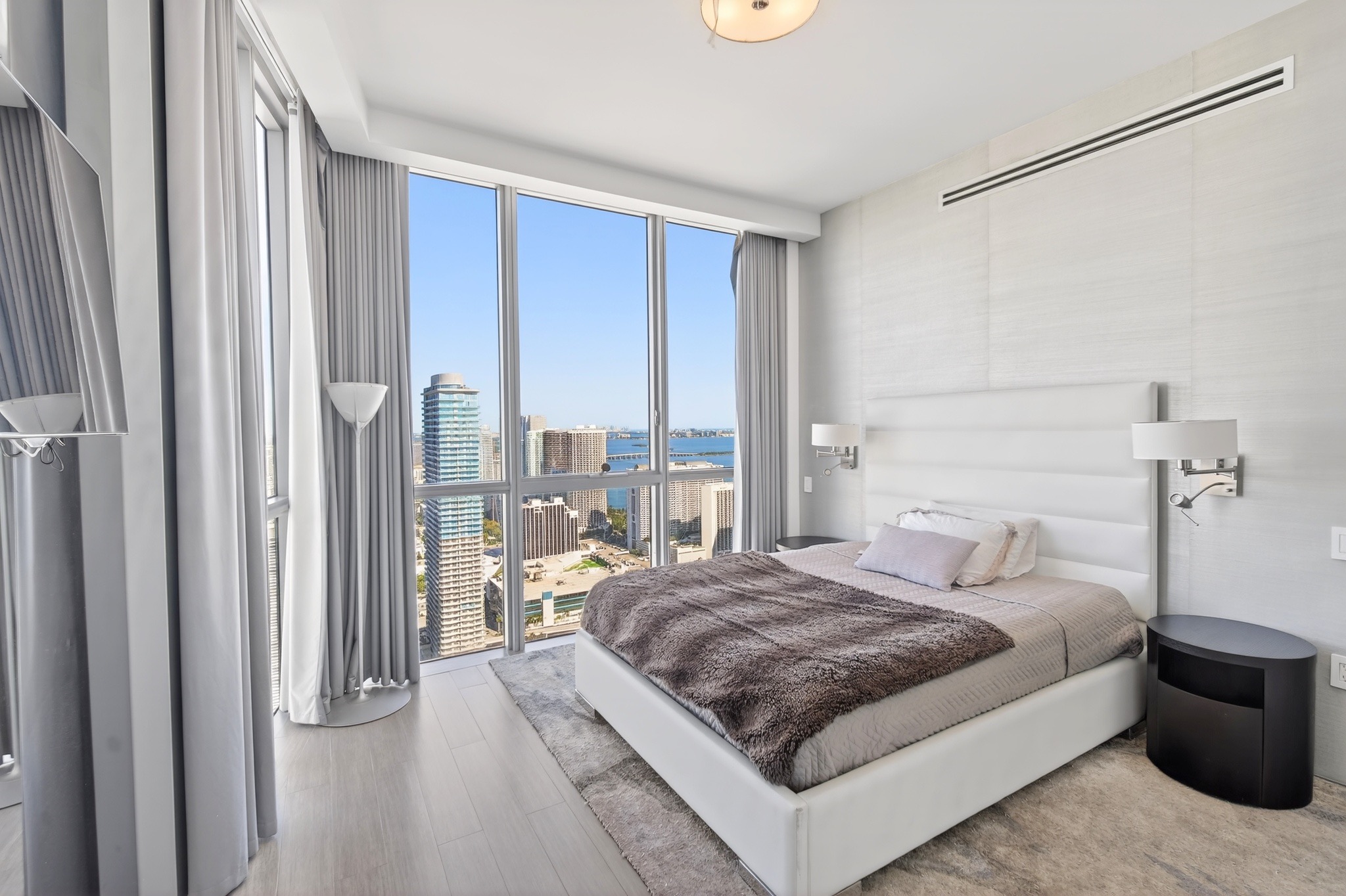 Bedroom with floor-to-ceiling Miami views