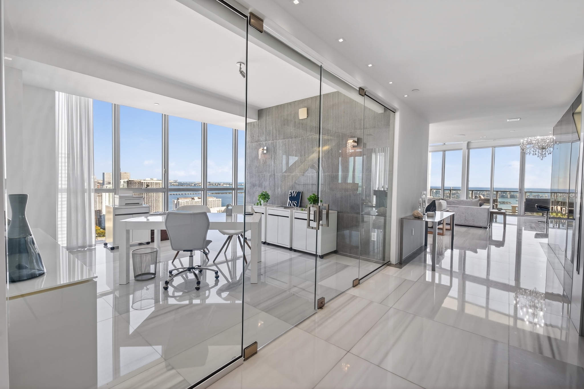 Glass-enclosed bath and open living area