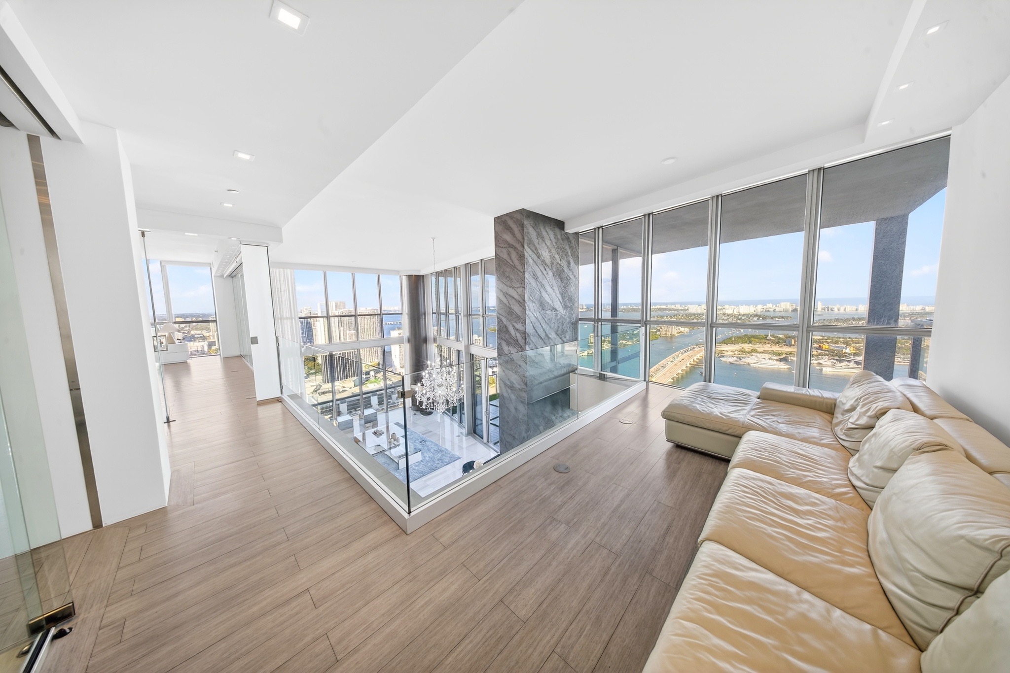 Waterfront sitting room with floor-to-ceiling glass