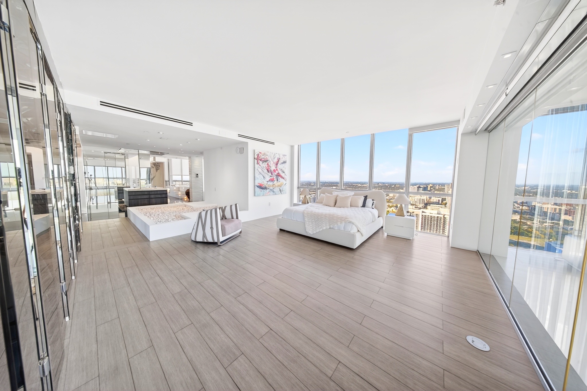 Bright bedroom with expansive skyline views